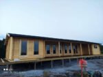 Maison en bois en kit « Holiday L » | 18 x 7 m – Image 9